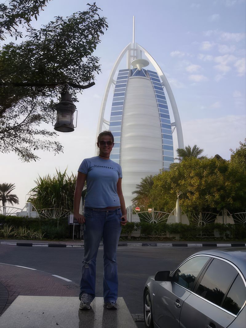Kelly standing in front of the Burj Al Arab in Dubai